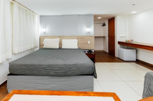 a bedroom with a bed in a room at El Aram Beach Boa Viagem in Recife