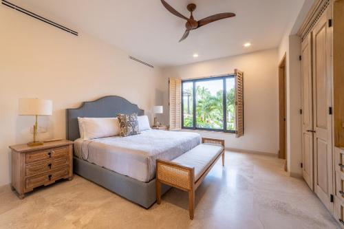 a bedroom with a large bed and a window at Punta Mita 4BR Paradise Golf Course Views in Punta Mita