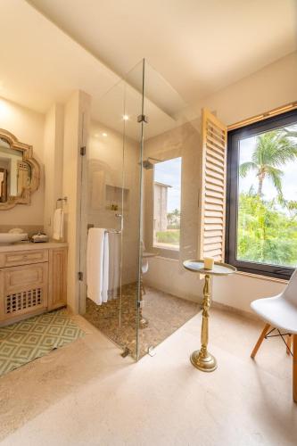 a bathroom with a shower with a glass door at Punta Mita 4BR Paradise Golf Course Views in Punta Mita