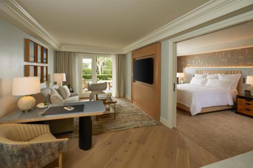a hotel room with a bed and a desk at Waldorf Astoria Monarch Beach Resort & Club in Dana Point