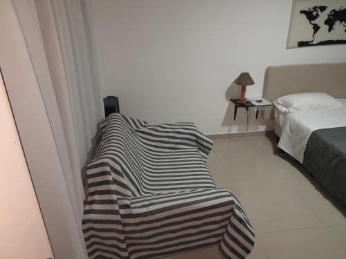 a room with a bed and a blanket on the floor at Bienvenidos a mi casa in Chajarí