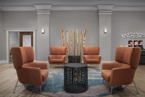 a waiting room with three chairs and a table at Hampton Inn Fort Lauderdale Downtown Las Olas Area in Fort Lauderdale