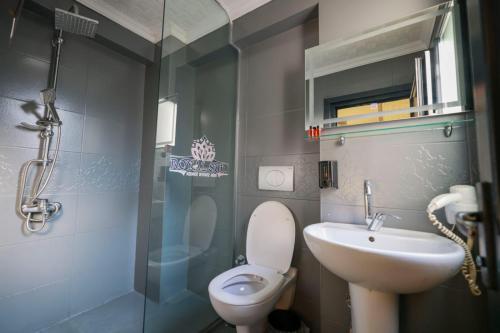 a bathroom with a toilet and a sink and a shower at İstanbul Royal Hotel Kumkapı in Istanbul