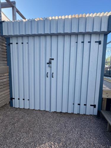a white garage door on the side of a building at Gamletull Guesthouse in Halmstad