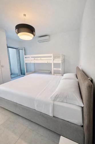 a bedroom with a large bed in a room at Bluelow Lakeview house in Dervio