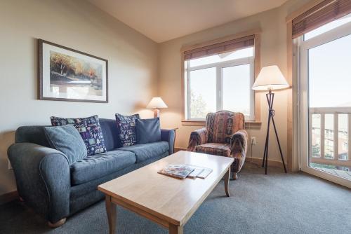 a living room with a couch and a coffee table at Sunstone 325 in Old Mammoth