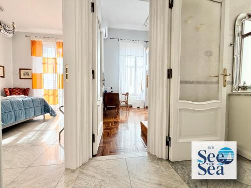 a room with a door with a sign that says see the sea at See The Sea B&B in Salerno