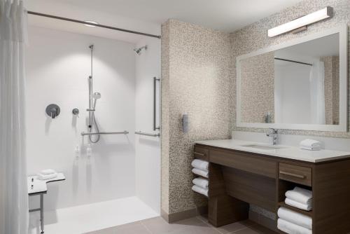 a bathroom with a sink and a shower at Home2 Suites By Hilton Virginia Beach Princess Anne in Virginia Beach