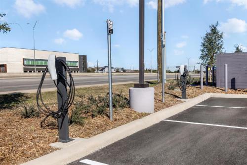 an empty parking lot with a bunch of electrical poles at Homewood Suites By Hilton Austin Airport in Austin
