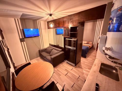 a small living room with a couch and a table at Bicentenario Alem in Villa María
