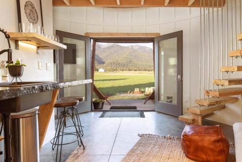 a kitchen with a view of a mountain at Clark Farm Silos #4 - Scenic Mountain Views in Kalispell