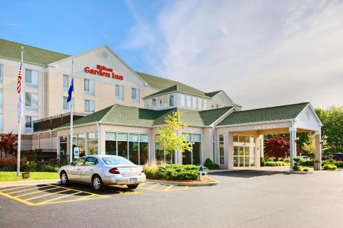 a hotel with a car parked in front of it at Hilton Garden Inn Springfield, IL in Springfield