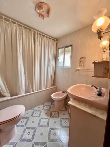 a bathroom with a toilet and a sink at Casa Vista Hermosa Rute in Rute