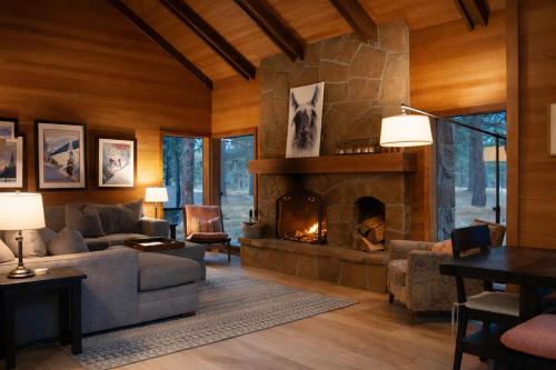 a living room with a large stone fireplace at Glaze Meadow 129 in Redmond