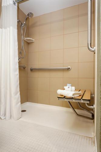 a shower in a bathroom with a shower curtain at Doubletree By Hilton Billings in Billings