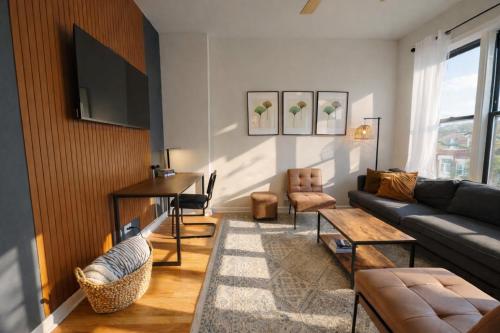 a living room with a couch and a table at Flexhome Ukrainian Village - 2BR - Convenient Walkability in Chicago