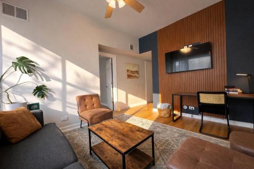 a living room with a couch and a table at Flexhome Ukrainian Village - 2BR - Convenient Walkability in Chicago