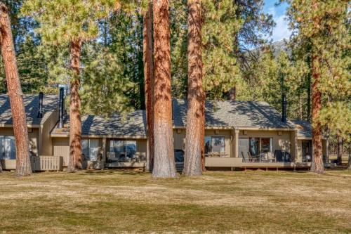 a house with trees in front of it at Lodge Condo 022 in Black Butte Ranch