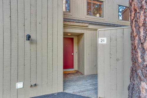 a building with a red door with the number at Lodge Condo 021 in Black Butte Ranch