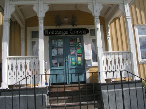 a ticket machine on the front of a house at Munkebergs Stugor & Vandrarhem in Filipstad