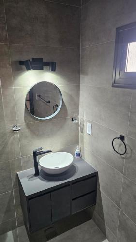 a bathroom with a sink and a mirror at Rincon del Malbec in Ciudad Lujan de Cuyo