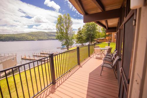 a balcony of a house with a view of a lake at Sun Castle Resort in Lake George