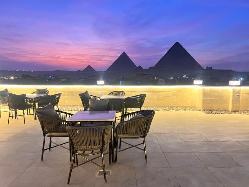 King's Gate Majestic pyramids & Sphinx view