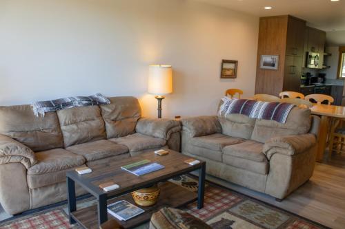 a living room with two couches and a coffee table at Lodge Condo 036 in Black Butte Ranch