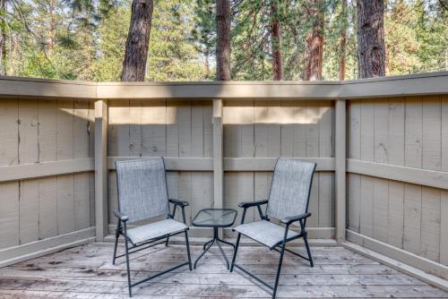 two chairs and a table on a porch at Lodge Room 024 in Black Butte Ranch
