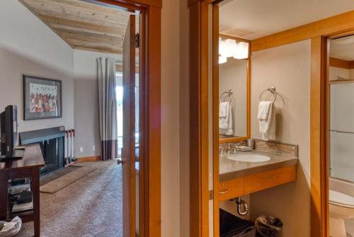 a bathroom with a sink and a mirror at Lodge Room 023 in Black Butte Ranch