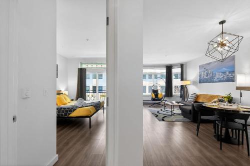 a living room and dining room with a couch and a table at Vibrant City Gem/99 Walk/Pike Pl/Pool/Pet/Parking in Seattle