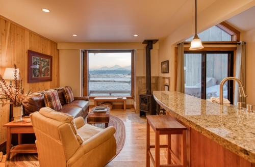 a living room with a couch and a table at Country House 065 in Black Butte Ranch