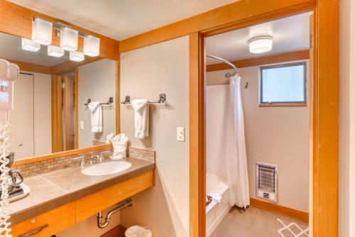 a bathroom with a sink and a mirror at Lodge Room 020 in Black Butte Ranch