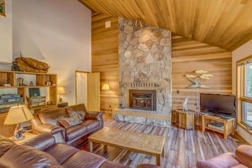 a living room with a couch and a fireplace at East Meadow 017 in Black Butte Ranch