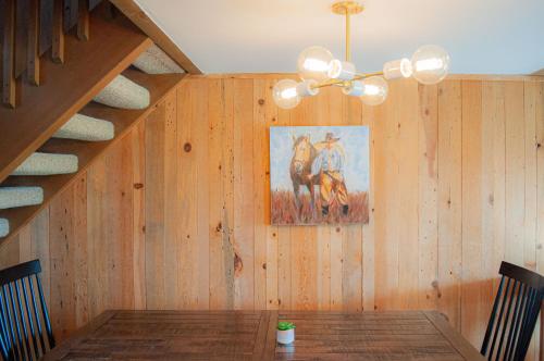 a dining room with a table and a painting on the wall at Country House 071 in Black Butte Ranch