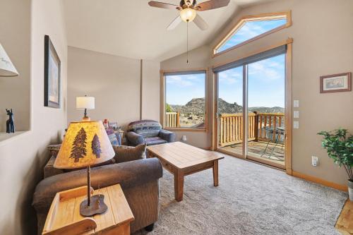 a living room with a couch and a table at Teepee Mountain 12A Condo in Estes Park