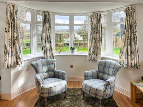 two chairs in a living room with windows at Island House - Uk51001 in Little Baddow