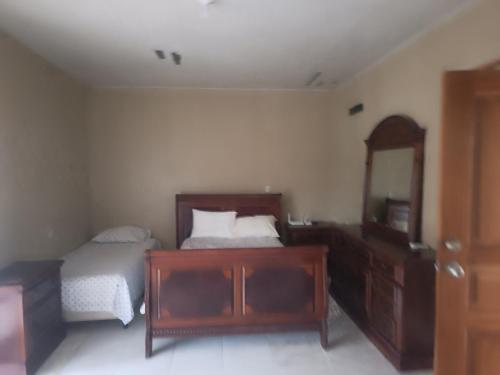 Llit o llits en una habitació de Ana' House