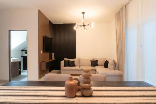 a living room with a table and a couch at Casa Romina in La Paz