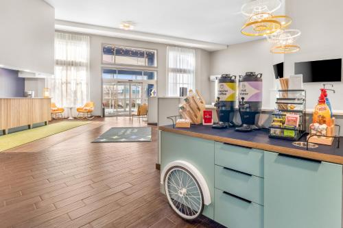 an office with a counter with a drink at Spark by Hilton Salt Lake City Central in Salt Lake City