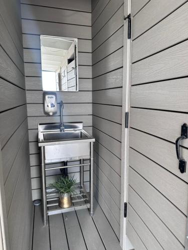 a bathroom with a sink and a mirror at Zaromelranch deck in Agua Dulce
