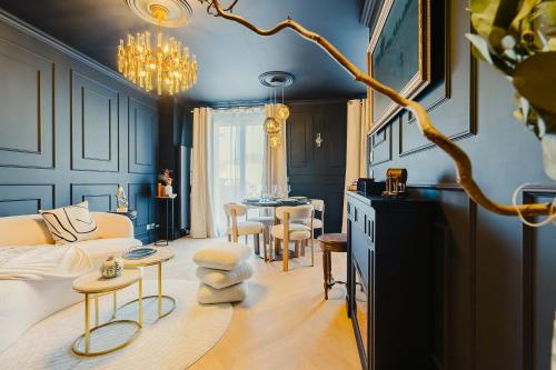 a living room with a couch and a table at Maison Saint Lazare in Vernon