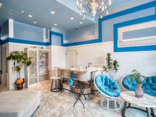 a living room with blue and white walls at Glory island okinawa SOBE in Naha