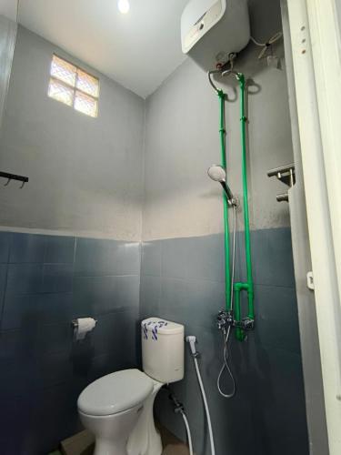 a bathroom with a toilet and a shower at Residence 168 in Gununganjar