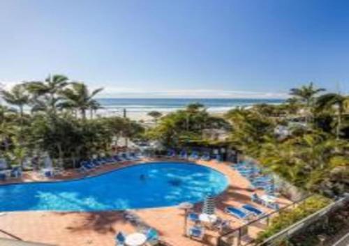 an overhead view of a swimming pool and the beach at The Rocks Resort Unit 3C in Gold Coast