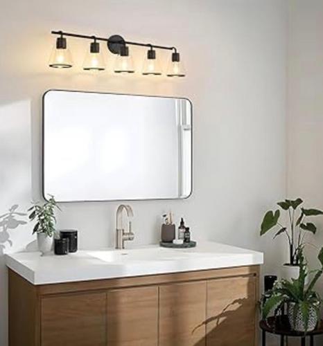 a bathroom with a sink and a large mirror at Downtown Central Edmonton Entire Unit Condo Non Smoking in Edmonton