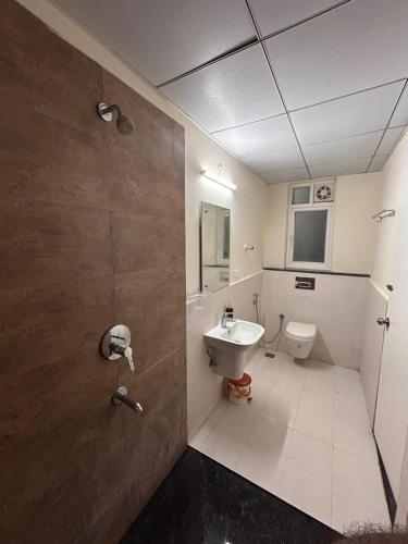a bathroom with a toilet and a sink at Premium Villa Stay Near the Airport Perfect for Families & Business Travelers in Hyderabad