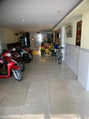 a group of motorcycles parked in a garage at Hotel Tài Phát in Can Tho