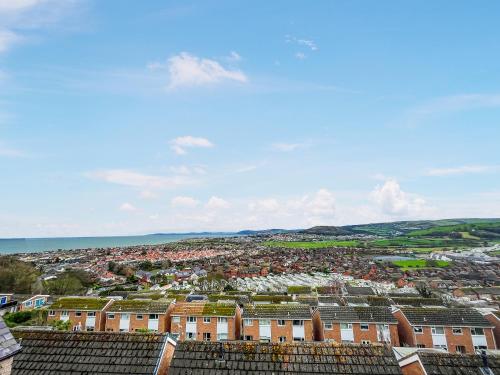 an aerial view of a city with houses at Sea-Scape in Penrhyn Bay