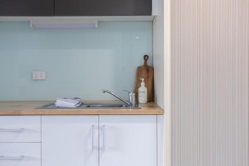 a kitchen with a sink and a counter top at Bay View Sunrise in Lorne